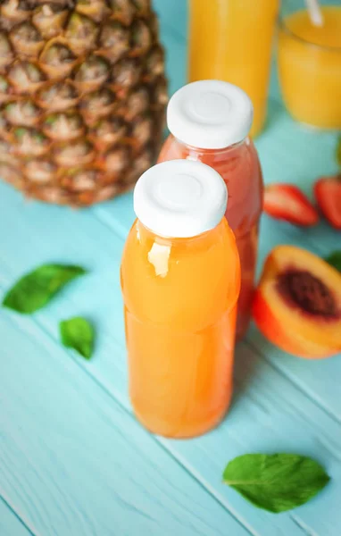 Bottles with fruit juices — Stock Photo, Image