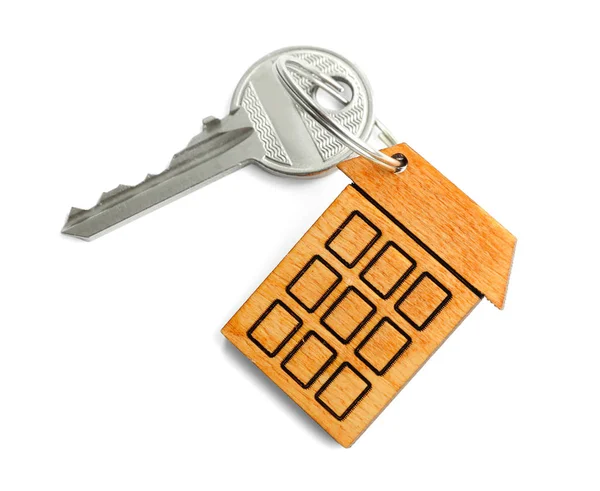 Ключ с безделушкой в форме дома — стоковое фото