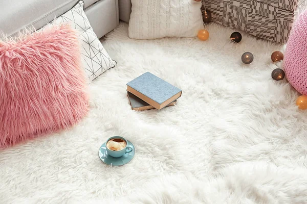 Soft white carpet with cup of coffee indoors — Stock Photo, Image