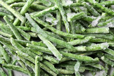 Arka plan, closeup olarak dondurulmuş yeşil fasulye