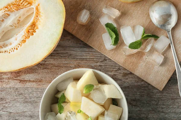 Composition with yummy melon on wooden table — Stock Photo, Image