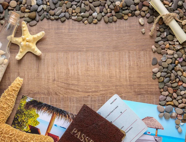 Composition with sea star, pebbles and passport on wooden background — Stock Photo, Image