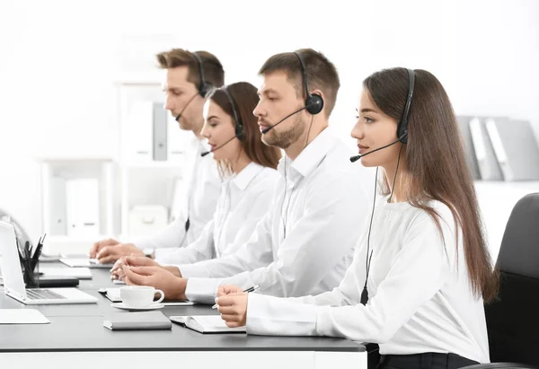 Consulting managers with headsets — Stock Photo, Image
