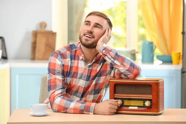 Young man listening to radio