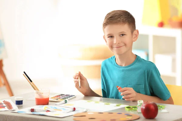 Little boy painting at table — Stock Photo, Image