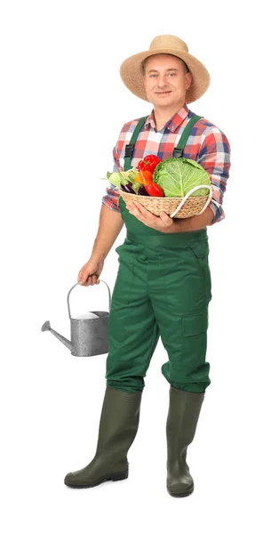 Agronom mit Gemüse und Gießkanne auf weißem Hintergrund — Stockfoto
