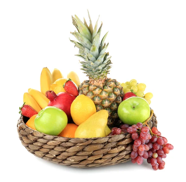 Wicker basket with different fruits on white background — Stock Photo, Image