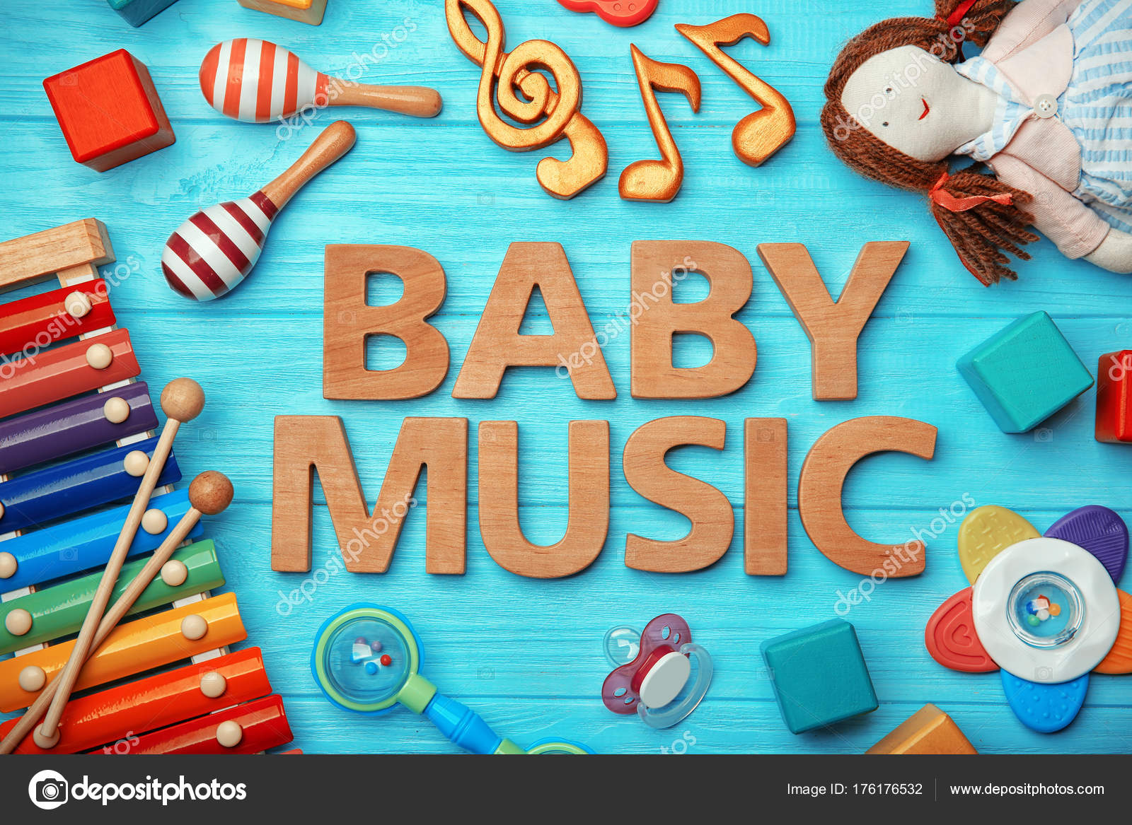 Text BABY MUSIC and toys on wooden background Stock Photo by