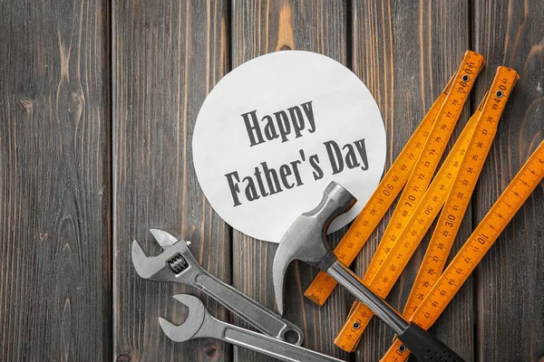 Set of tools with greeting card on wooden background. Father's Day concept — Stock Photo, Image
