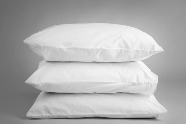 Blank soft pillows on light background — Stock Photo, Image