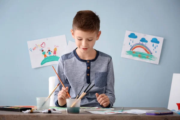 Little boy painting at table — Stock Photo, Image