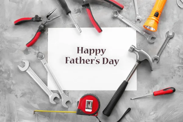 Set of tools with greeting card on grunge background. Father's Day concept — Stock Photo, Image