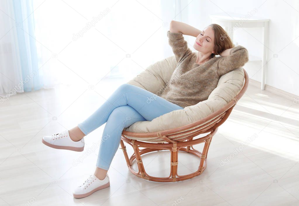 Happy young woman relaxing at home