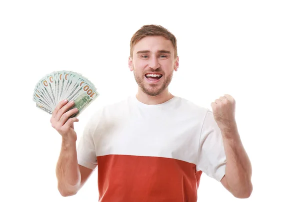 Happy young man with banknotes on white background — Stok Foto