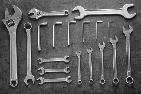 Set of combination wrenches on gray background