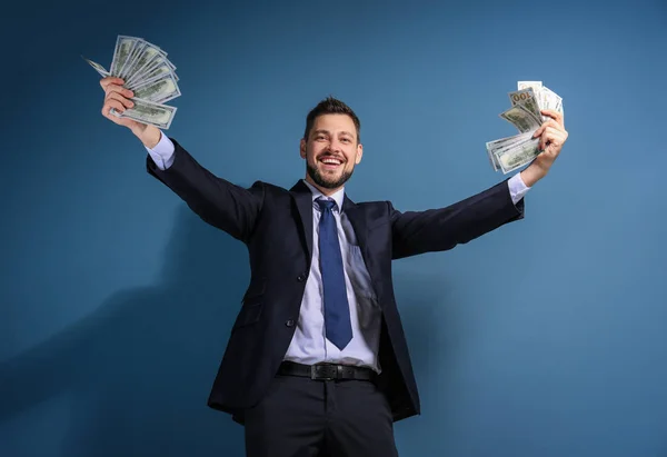 Stock exchange broker with money on color background — Stock Photo, Image