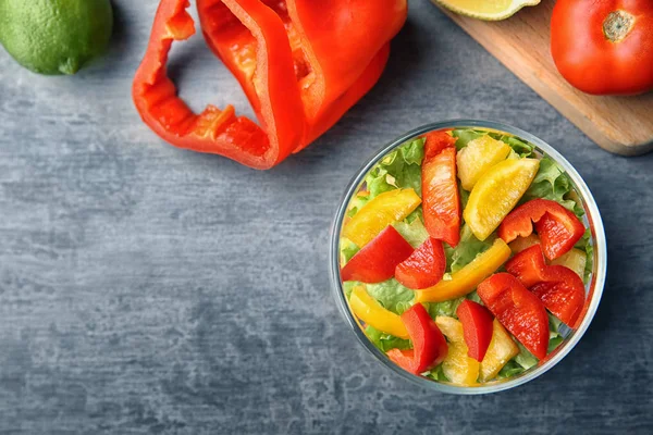 Delicious vegetable salad in jar on table