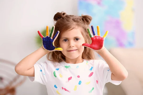 Little girl with painted hands indoors — Stock Photo, Image