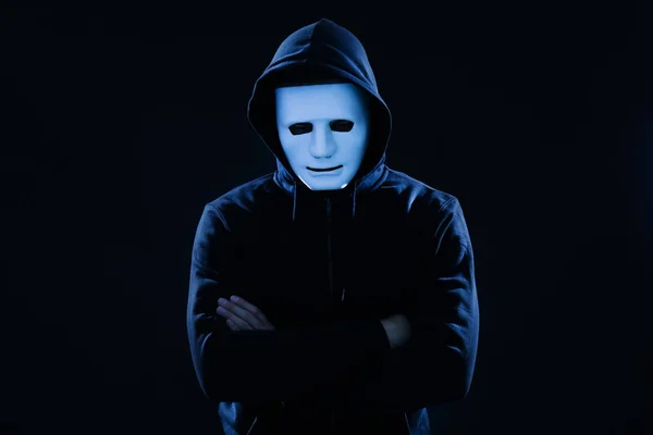 Hacker in mask on dark background — Stock Photo, Image