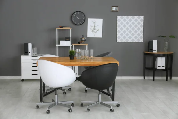 Modern office interior with black and white armchairs — Stock Photo, Image