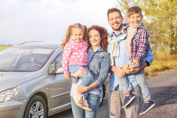 Young family with children near car, outdoors — Stock Photo, Image