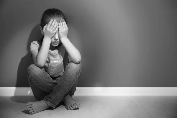 Little sad girl crying on floor. Abuse of children concept — Stock Photo, Image