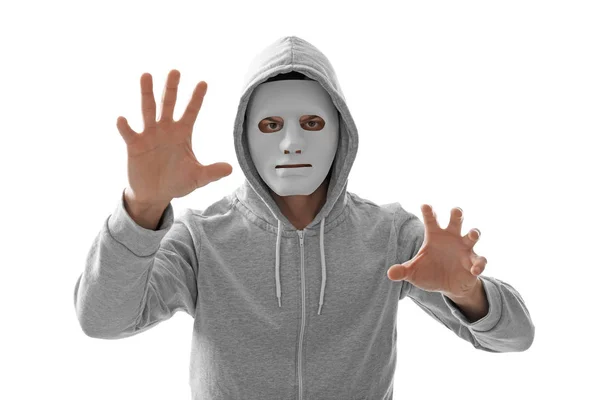 Hacker em máscara trabalhando com tela virtual no fundo branco — Fotografia de Stock