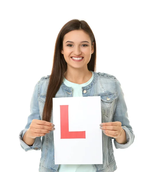 Young woman holding learner driver sign on white background — Stock Photo, Image