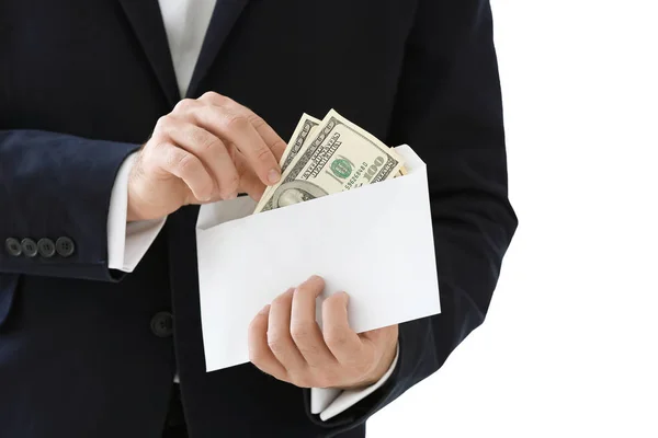 Businessman with money in envelope on white background. Corruption concept — Stock Photo, Image