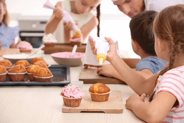 Group of children and teacher in kitchen during cooking classes Stock Image