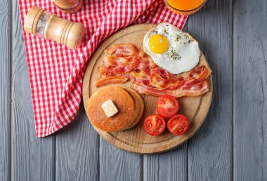 pancakes, tomatoes, fried bacon and egg clipart