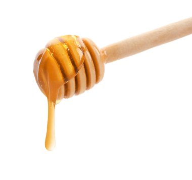 Beyaz arka planda bal damlıyor