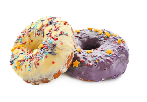 Bunte Donuts mit Streusel auf weißem Hintergrund — Stockfoto