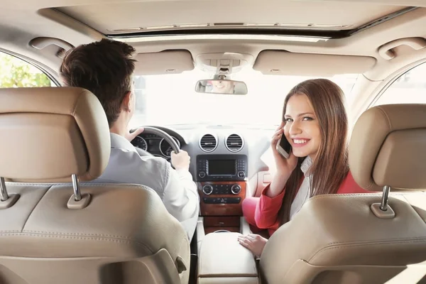 Beautiful young couple in car — Stock Photo, Image