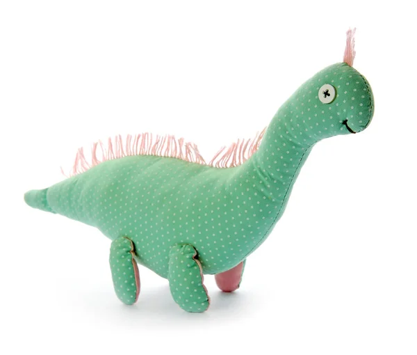 Niedlicher Spielzeug-Dinosaurier auf weißem Hintergrund — Stockfoto