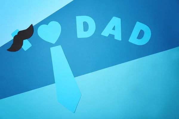 Composition with phrase I LOVE DAD for Father's Day on color background — Stock Photo, Image