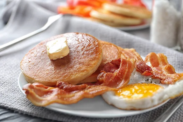 pancakes, fried bacon and egg
