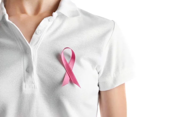 Woman with pink ribbon on t-shirt against white background. Breast cancer awareness concept — Stock Photo, Image