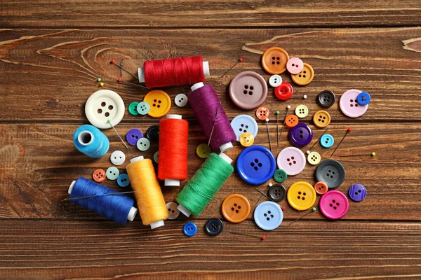 Accessories for tailoring on wooden table — Stock Photo, Image