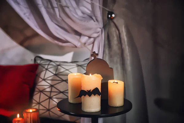Creepy candles for Halloween on table indoors — Stock Photo, Image
