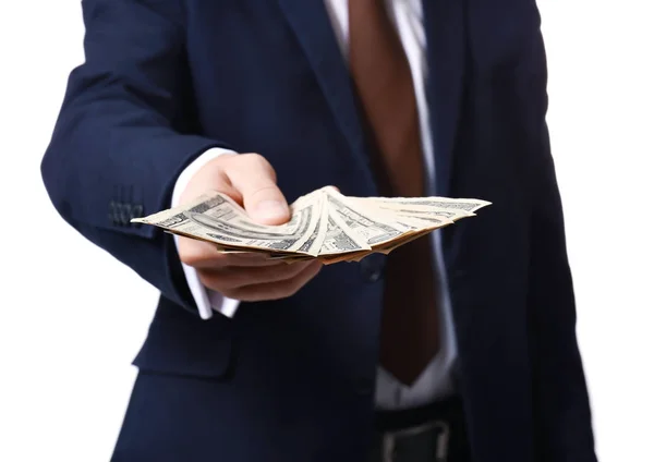 Muž ve formálním obleku drží peníze na bílém pozadí, closeup — Stock fotografie