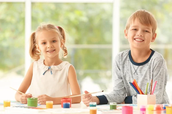 Cute children painting pictures at table indoors — Stock Photo, Image
