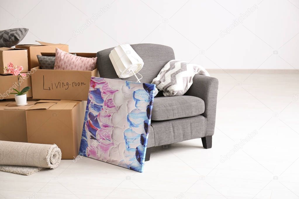 Carton boxes with stuff in room. Moving house concept