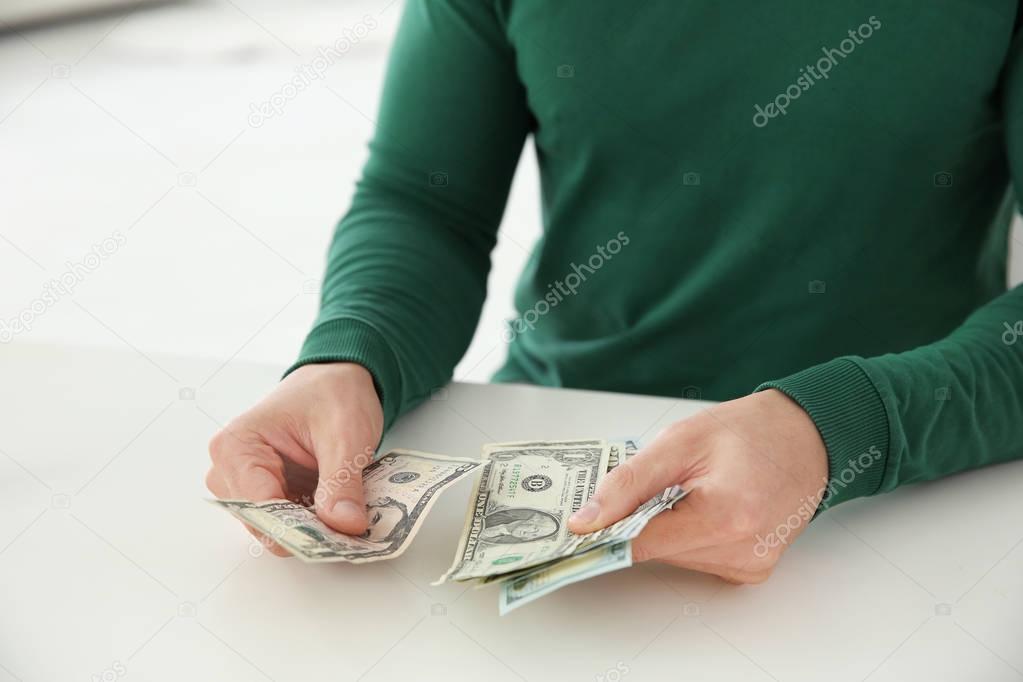 Man counting money at table, closeup — Stock Photo © belchonock #177087544