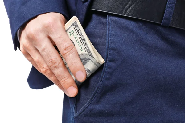 Чоловік в офіційному костюмі кладе гроші в кишеню на білому тлі, крупним планом — стокове фото
