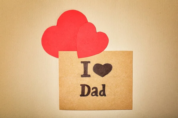 Composition with phrase I LOVE DAD for Father's Day on craft paper — Stock Photo, Image