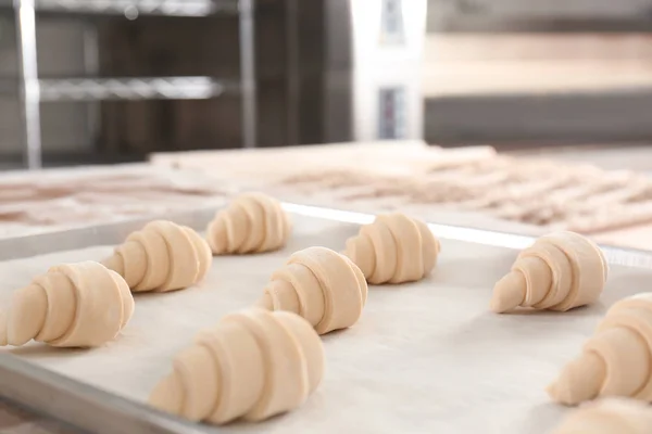 Raw crescent rolls on table — Stock Photo, Image