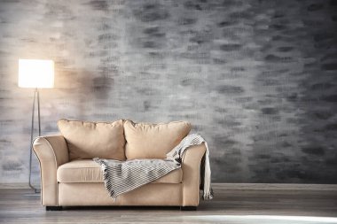 Comfortable sofa and floor lamp clipart