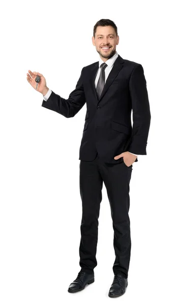 Salesman holding car key — Stock Photo, Image