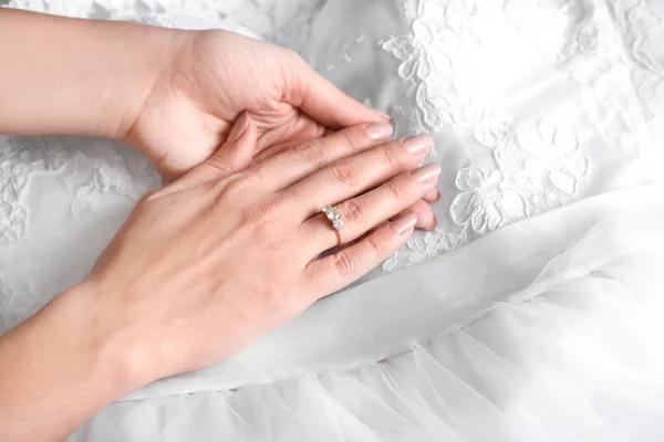 Woman's hand with beautiful engagement ring on lace — Stock Photo, Image